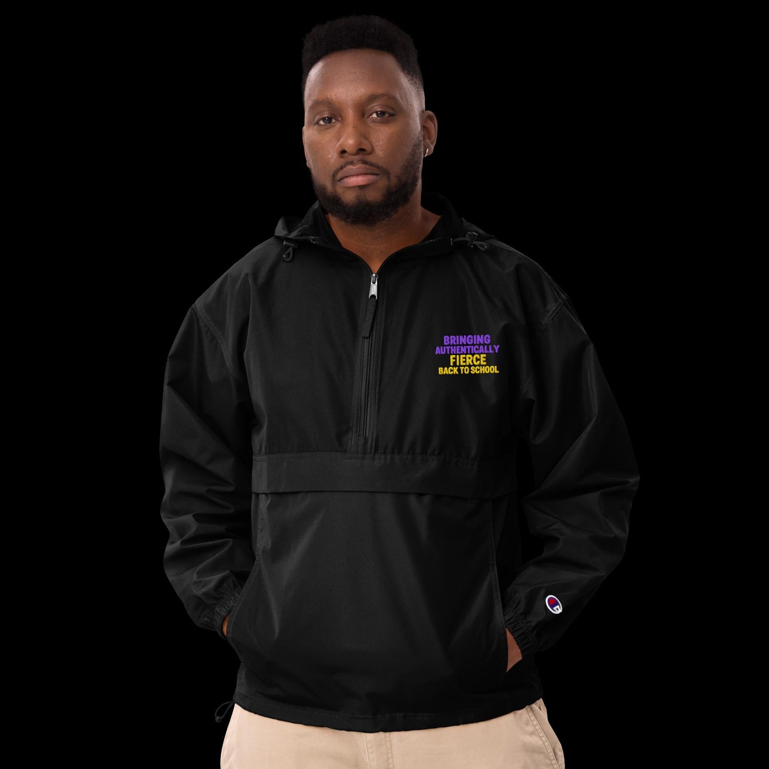 male model wearing black Authenically Fierce pullover jacket, perfect for educators and professionals during back-to-school season.